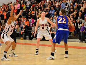 Led by Kayla Burton (#22, class of 2013), South upset North in the 2013 girls' basketball state tournament.